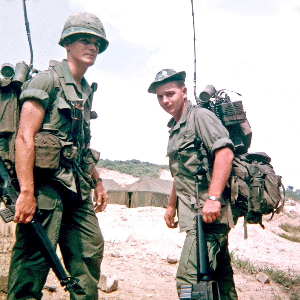 Two radiomen of the 1st Battalion, 6th Infantry, at a base camp in Vietnam