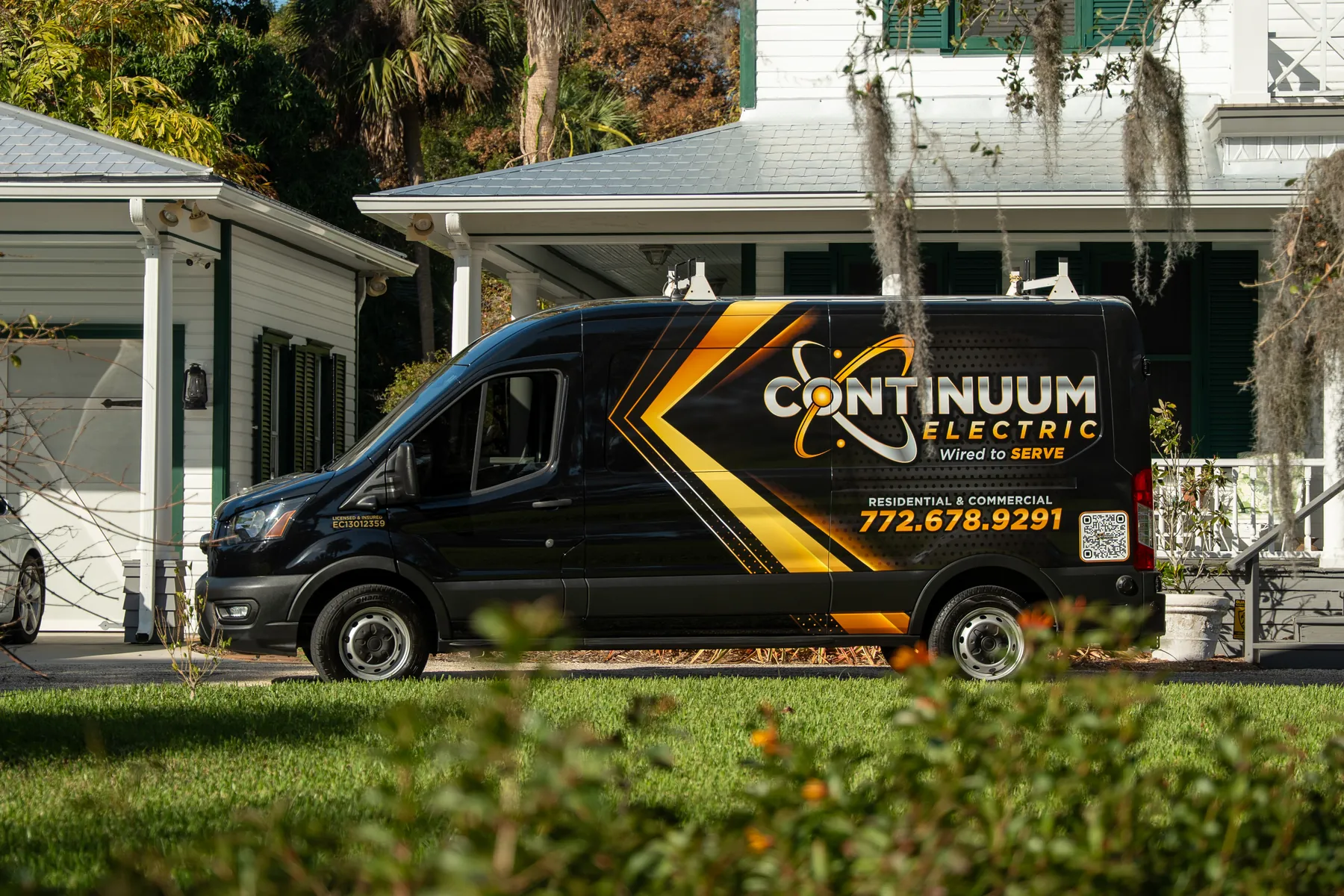 The wrapped Continuum van on a quiet street