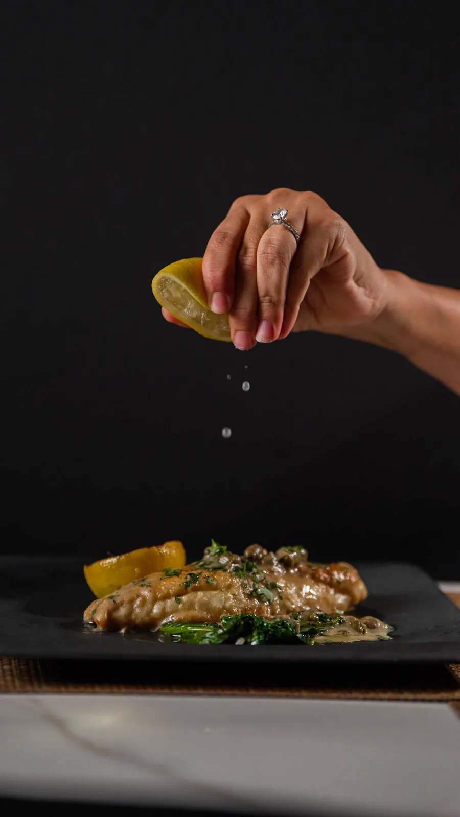 A lemon squeezed over the fish