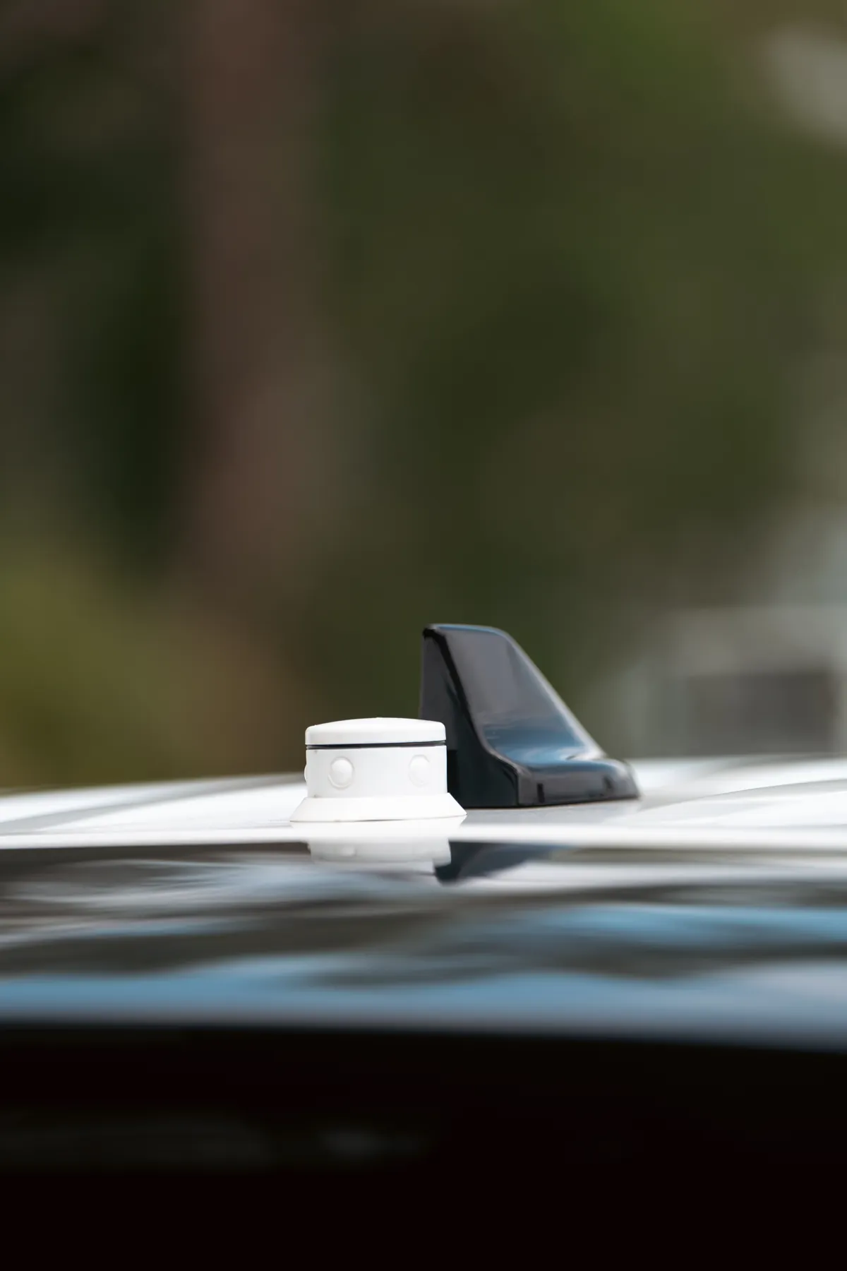 A white StopAmbush sensor pod on the roof of a patrol car